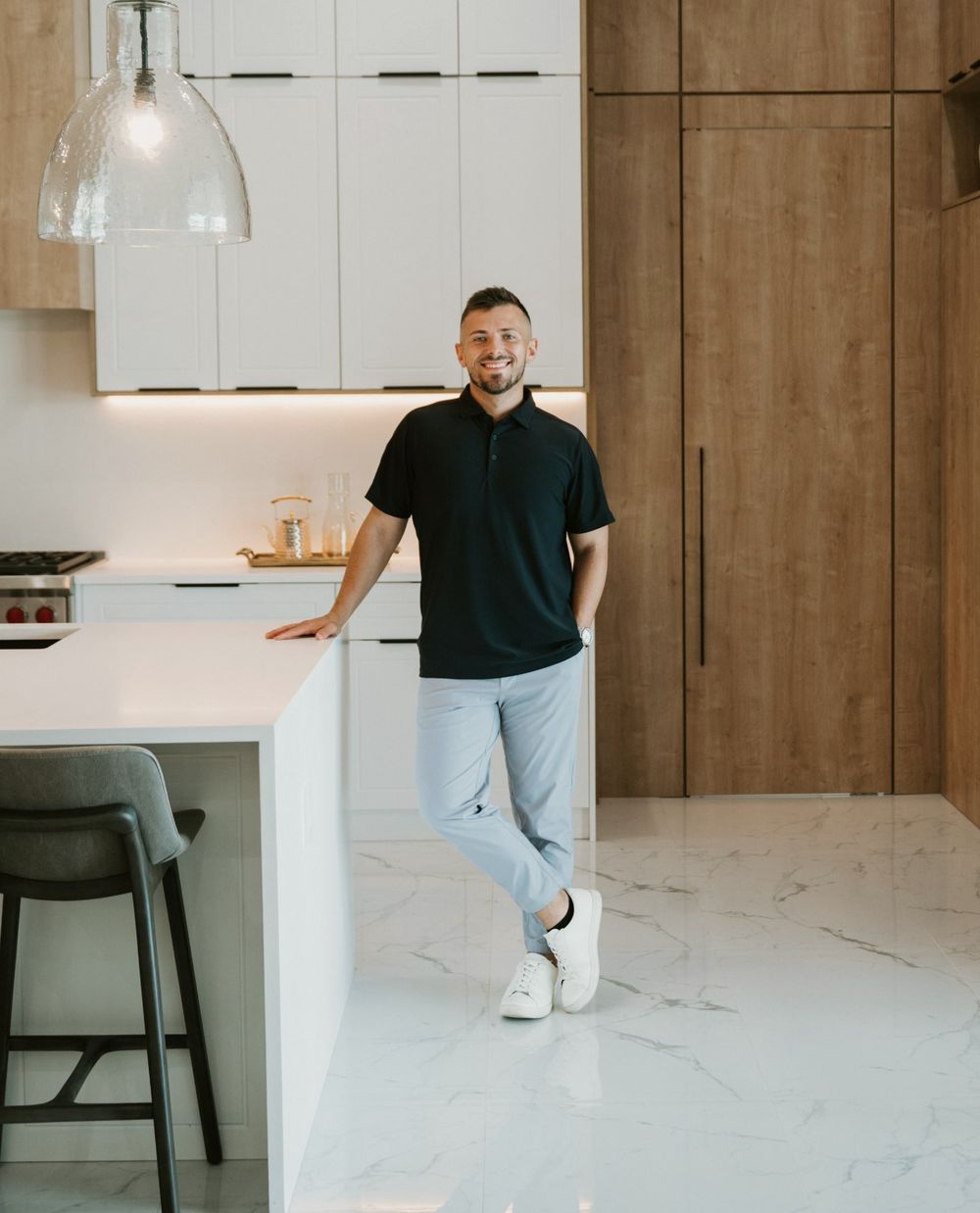 Ross Pino leaning on a kitchen island