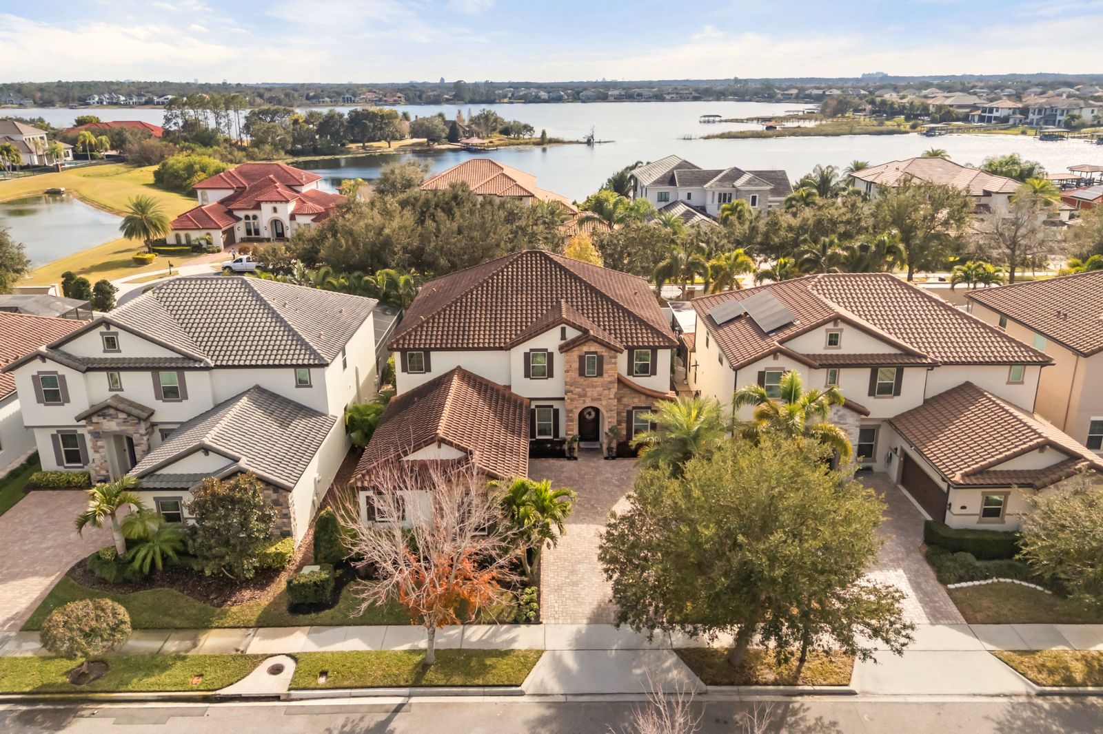 Aerial view of a Windermere estate with the lake behind it